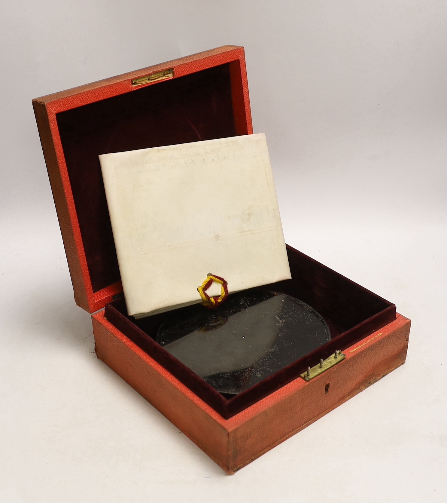 A cased George V Letters Patent related royal parchment document with large wax seal attached, seal separately encased within a tinned cylindrical case, seal 16cm diameter